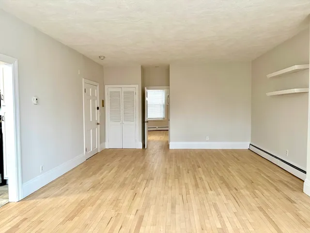 a view of an empty room and window