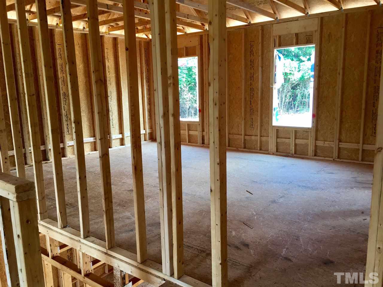 1008 Mills Street Raleigh, NC 27608 - Photo 2 of 3 a view of a porch with wooden floor