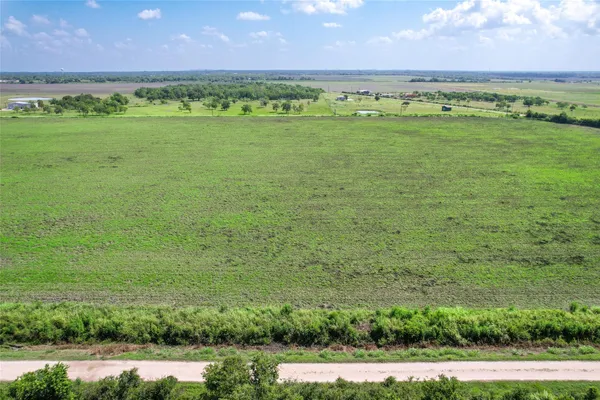 a view of a golf course with a big yard