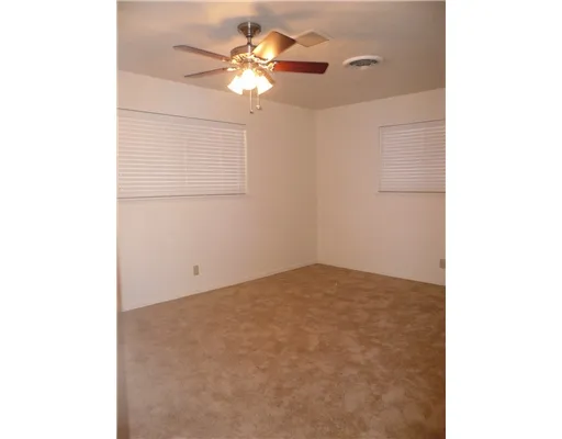 a view of a room with a fan