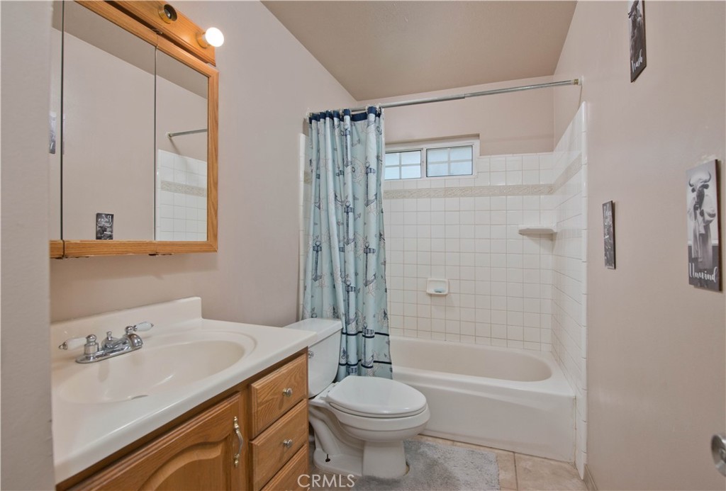 29262 Florabunda Road Canyon Country, CA 91387 - Photo 15 of 27 a bathroom with a sink toilet and shower