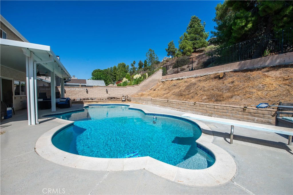 29262 Florabunda Road Canyon Country, CA 91387 - Photo 19 of 27 a view of a swimming pool with an outdoor space