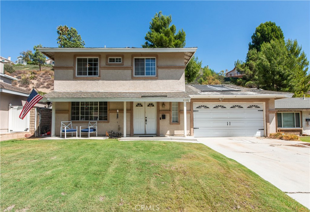 29262 Florabunda Road Canyon Country, CA 91387 - Photo 2 of 27 a front view of a house with a yard