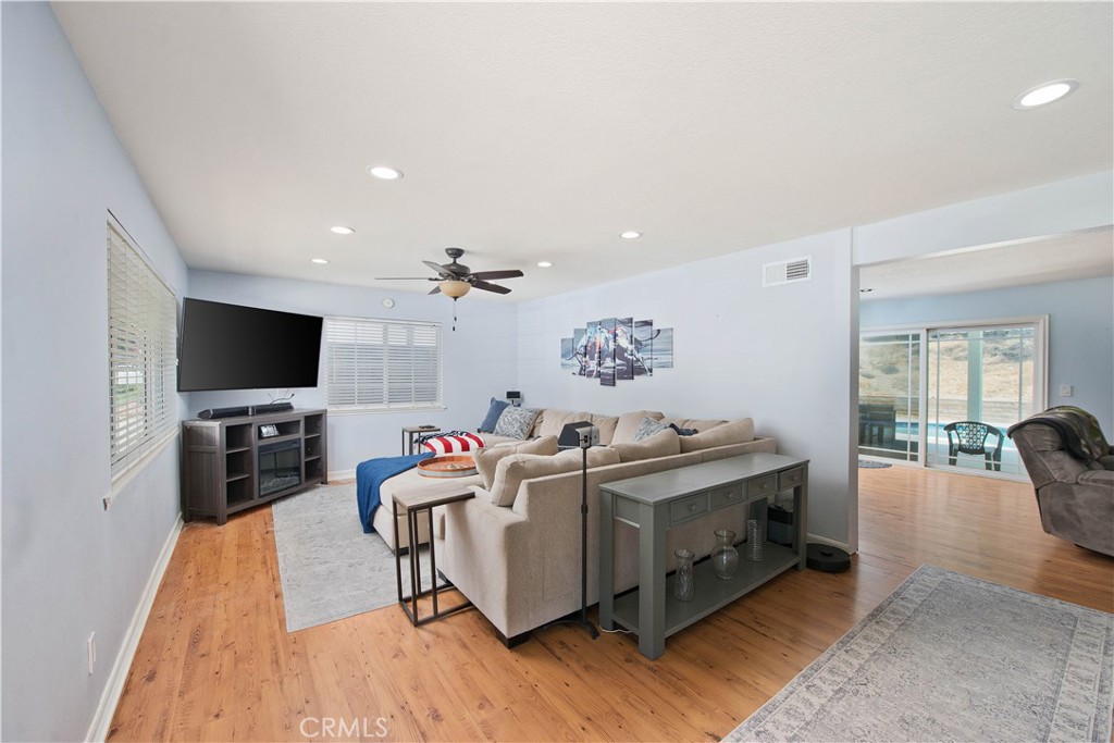 29262 Florabunda Road Canyon Country, CA 91387 - Photo 3 of 27 a living room with furniture and a flat screen tv