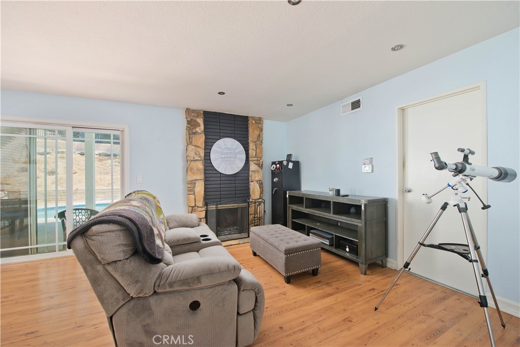 29262 Florabunda Road Canyon Country, CA 91387 - Photo 10 of 27 a living room with furniture a couch and a window