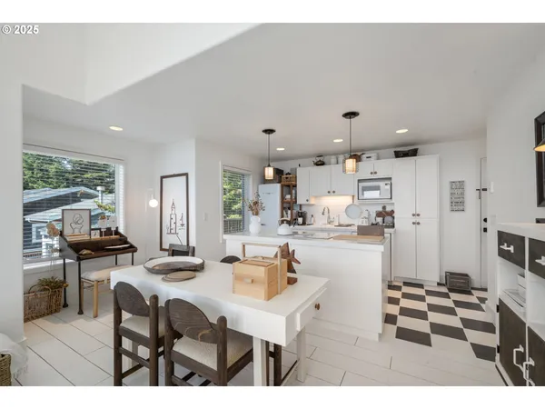 a kitchen with stainless steel appliances kitchen island granite countertop a sink and cabinets