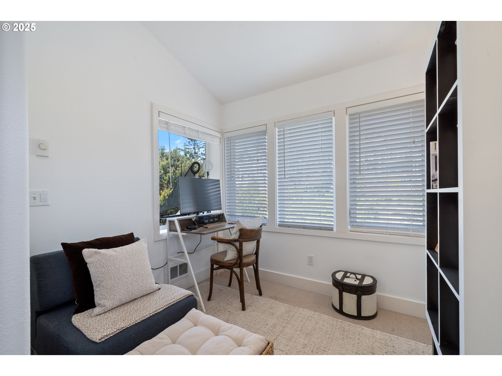 505 Capes Drive, Unit 9 Oceanside, OR 97141 - Photo 22 of 45 a living room with furniture and a window