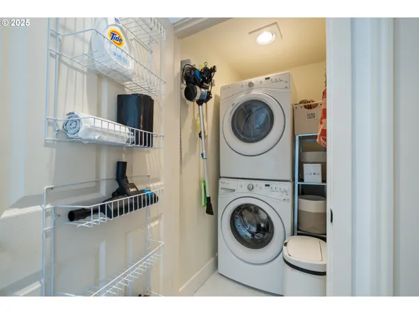 a bathroom with a glass shower door and a sink