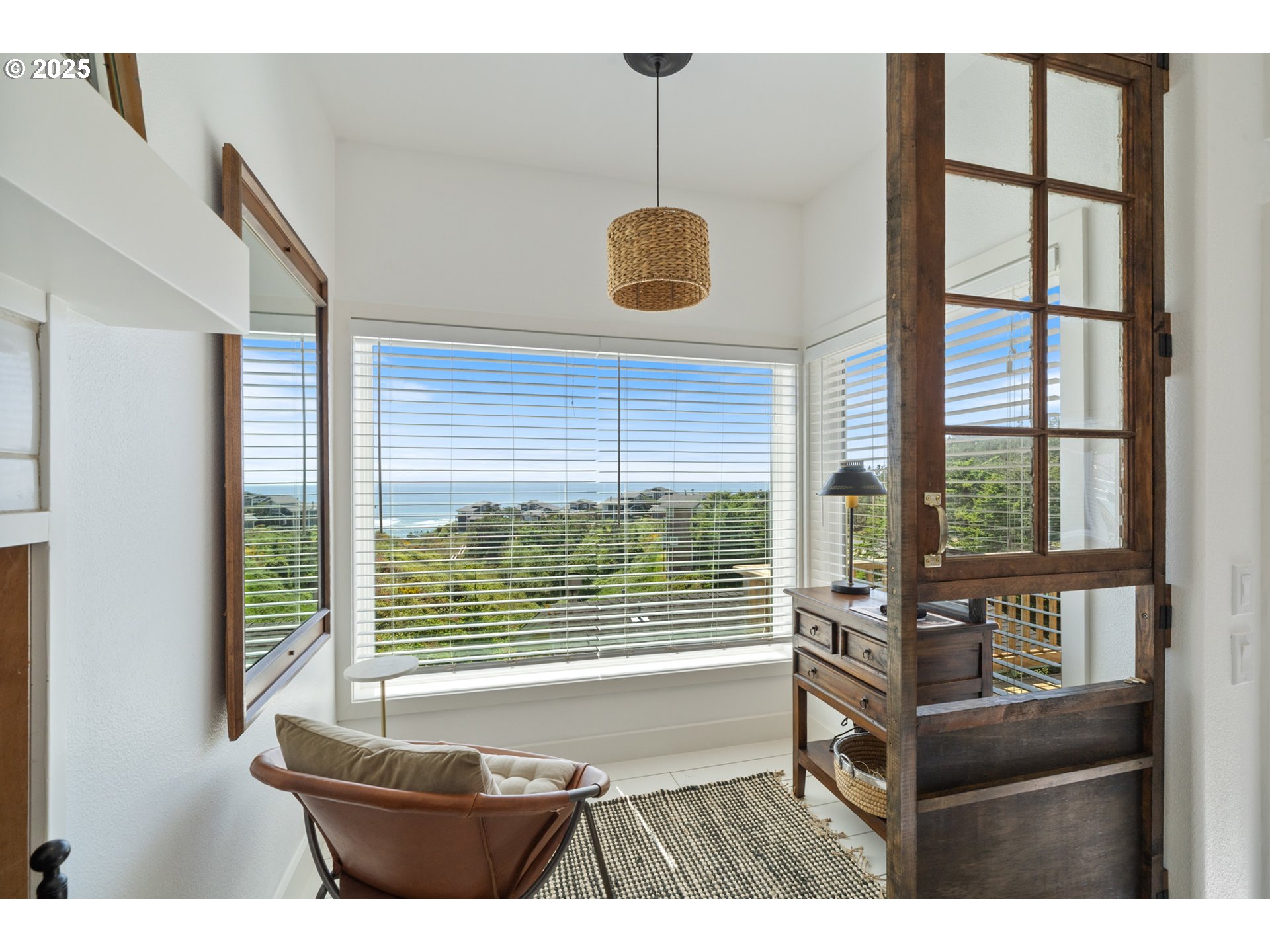 505 Capes Drive, Unit 9 Oceanside, OR 97141 - Photo 6 of 45 a living room with furniture and a window