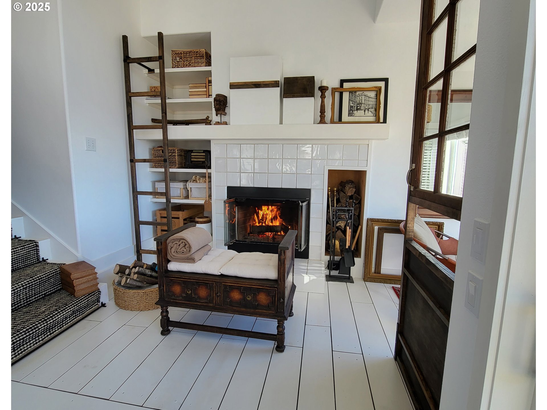 505 Capes Drive, Unit 9 Oceanside, OR 97141 - Photo 10 of 45 a living room with furniture and a fireplace
