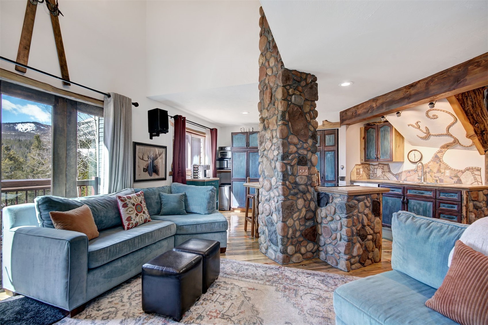 9460 Ryan Gulch Road, Unit 9460 Silverthorne, CO 80498 - Photo 9 of 39 a living room with furniture and a large window