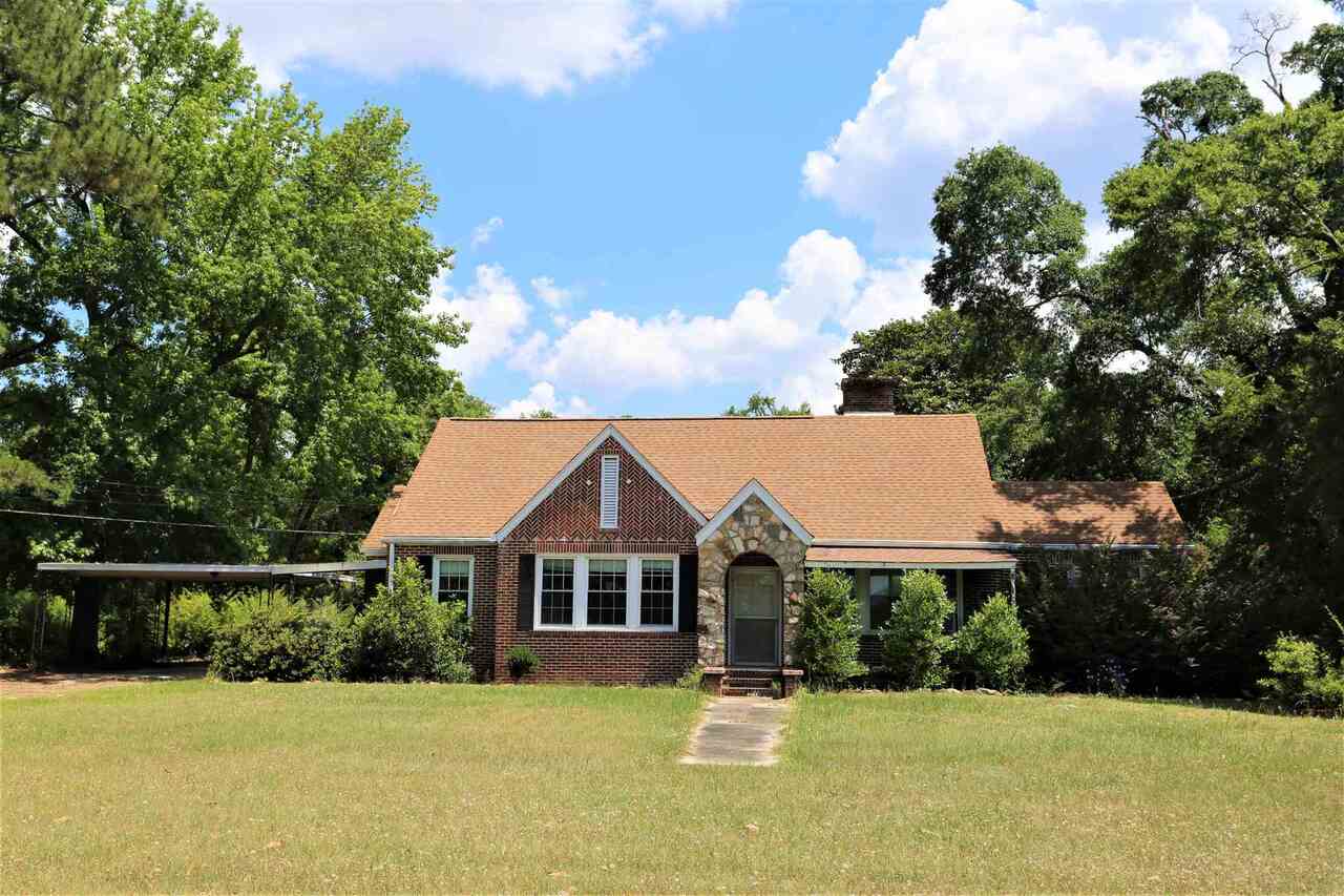 52 West Main Street Butler, GA 31006 - Photo 1 of 1 a front view of a house with yard and green space