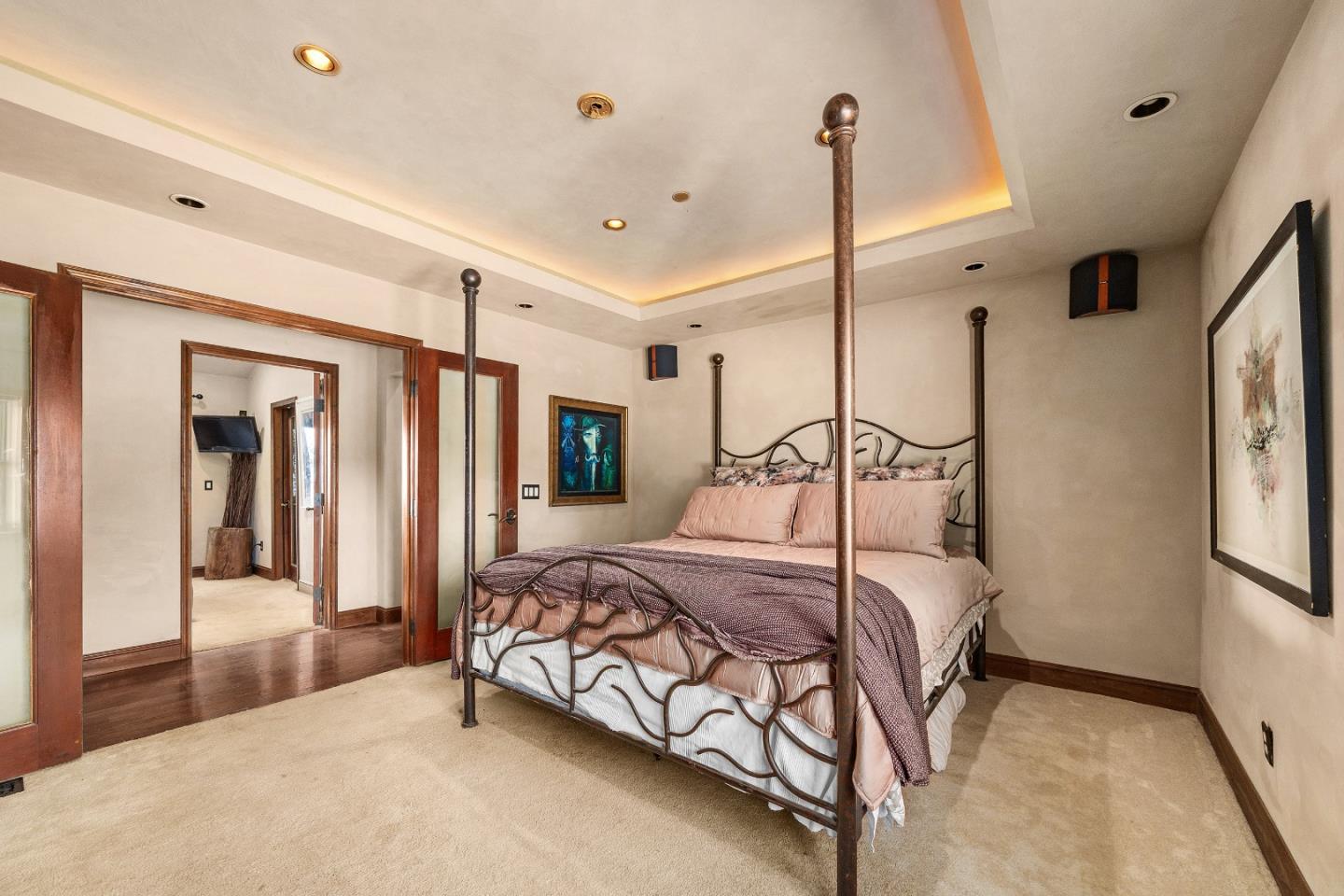 19375 Montevina Road Los Gatos, CA 95033 - Photo 16 of 36 a bedroom with a bed a mirror and a walk in closet