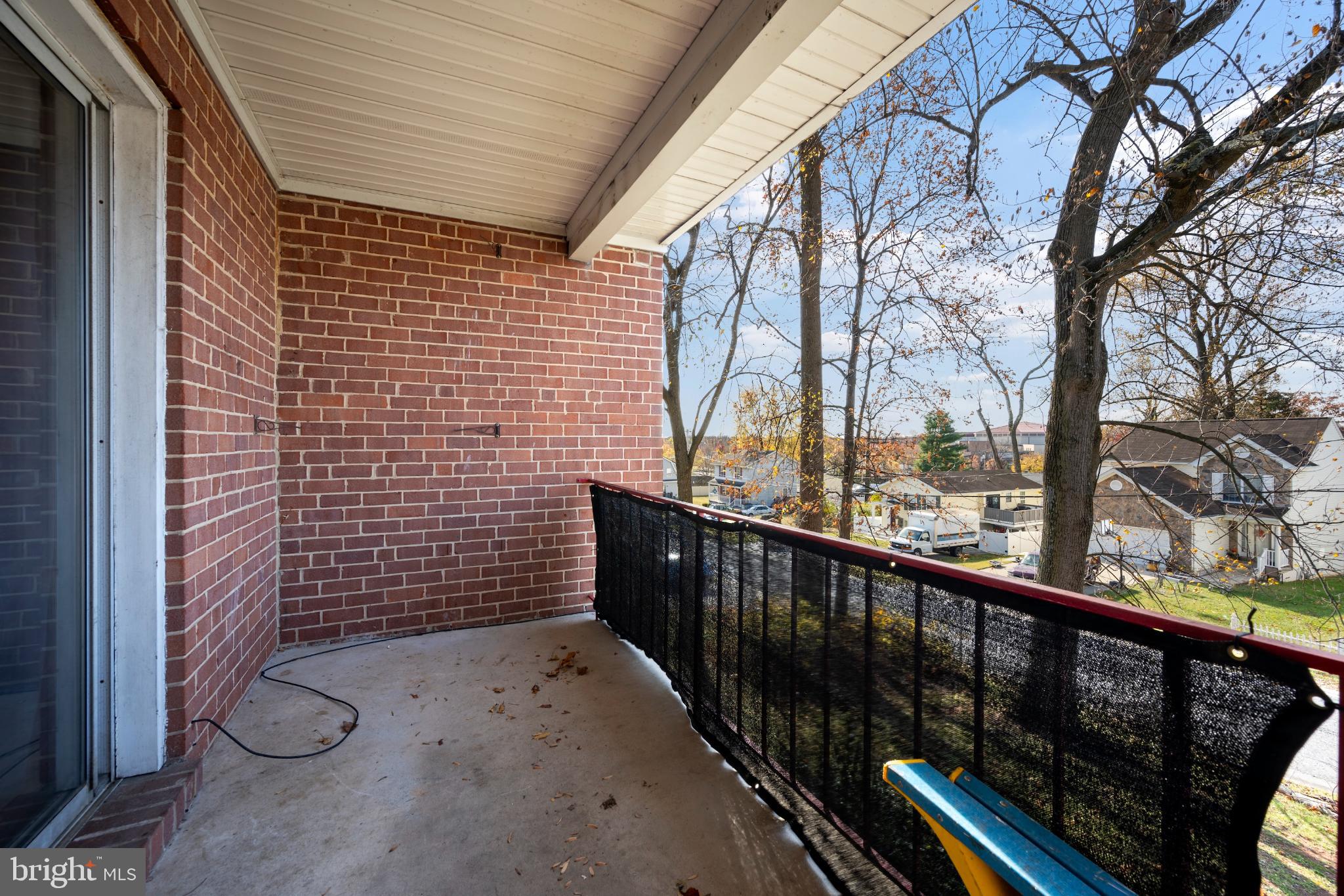 6511 Parsons Avenue Baltimore, MD 21215 - Photo 18 of 25 a view of a pathway of a building from a balcony