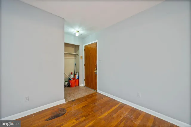 a view of hallway with wooden floor