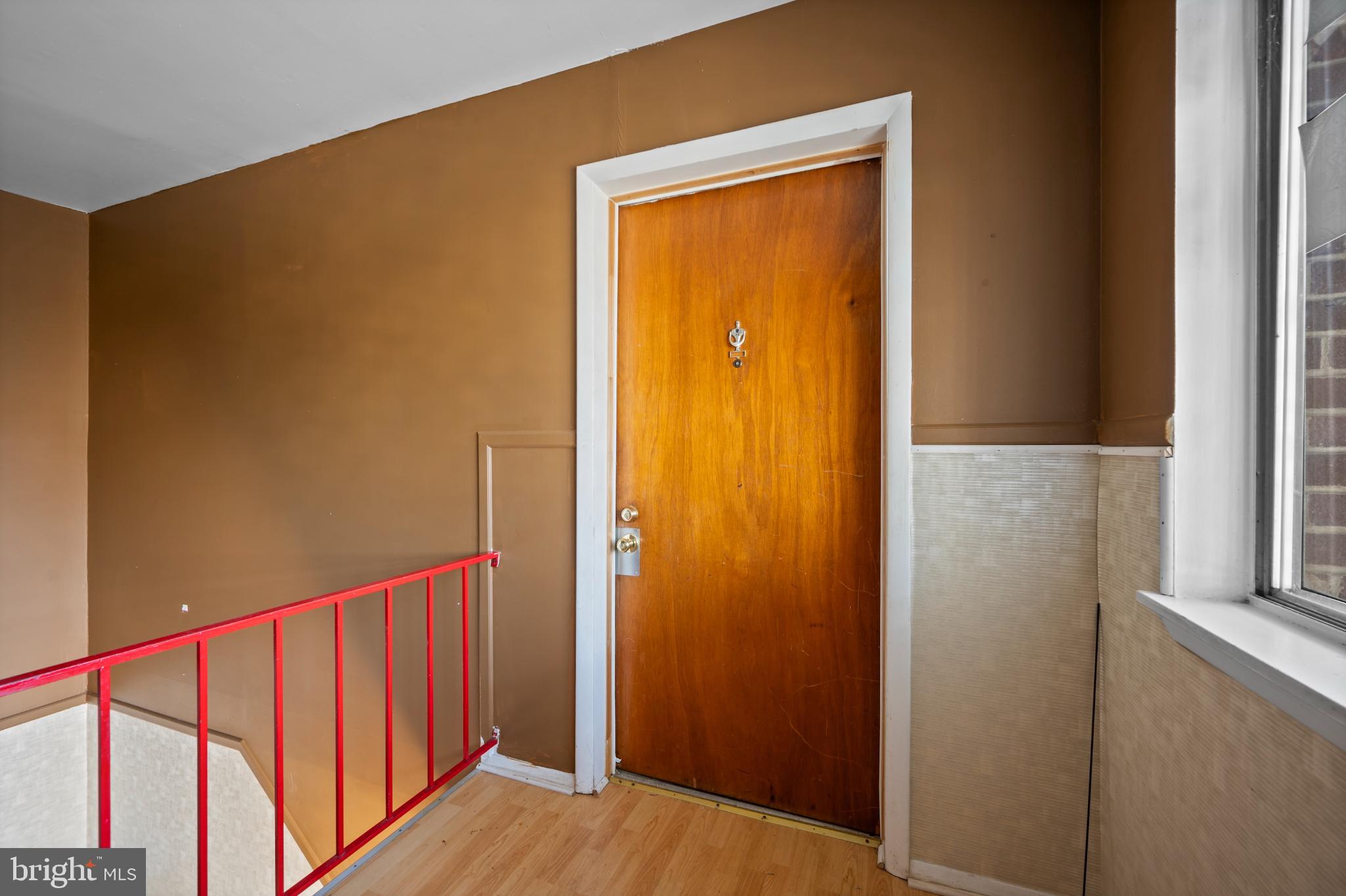 6511 Parsons Avenue Baltimore, MD 21215 - Photo 2 of 25 a view of a hallway with wooden floor