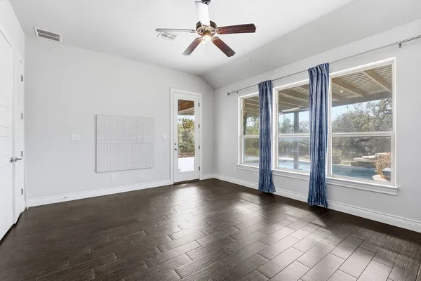 a living room with furniture kitchen view and a fireplace