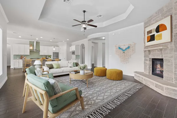 a living room with furniture and a fireplace