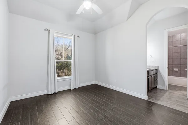 a view of an empty room with a sink and dishwasher