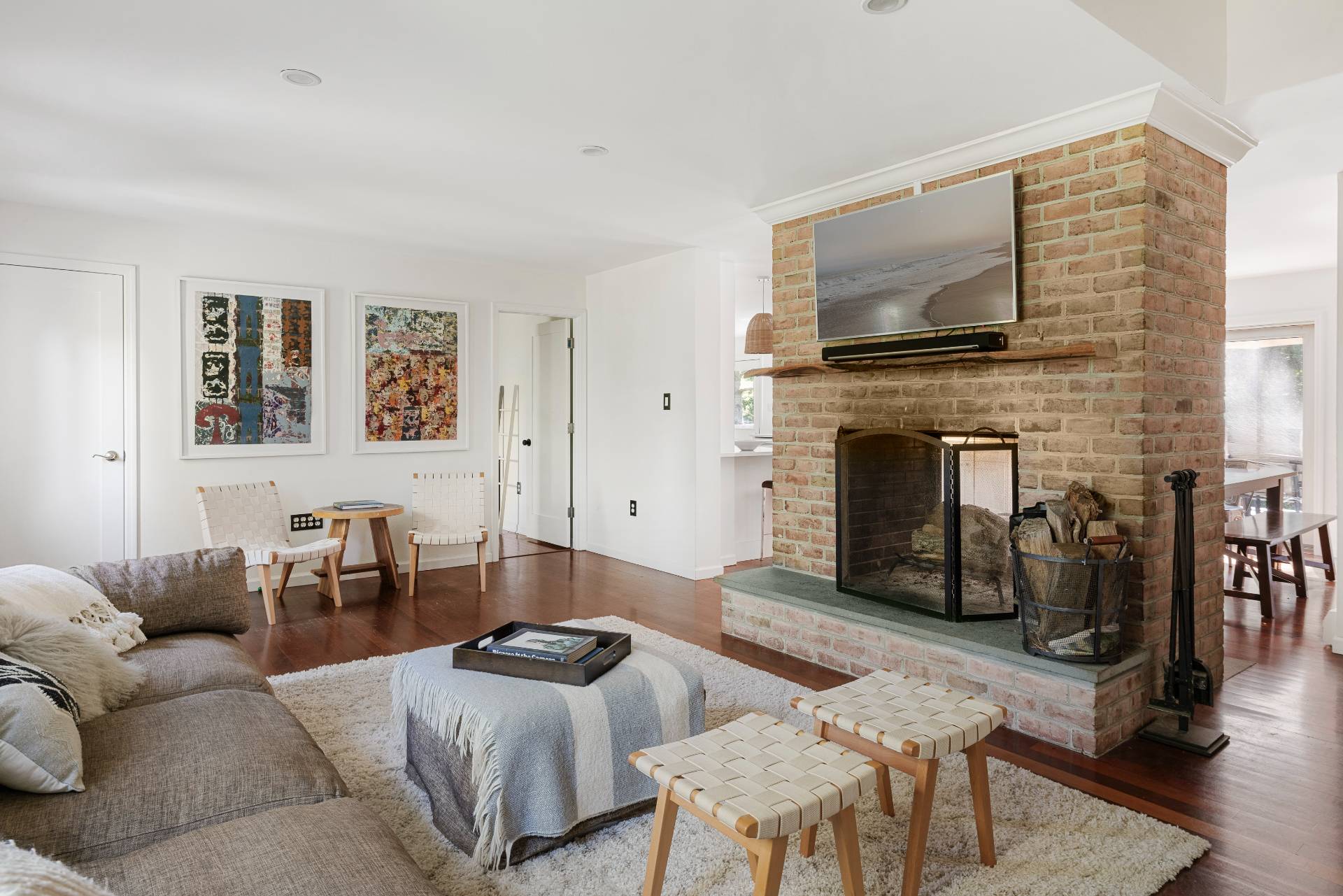 312 Noyack Road Southampton, NY 11968 - Photo 4 of 18 a living room with furniture and a flat screen tv