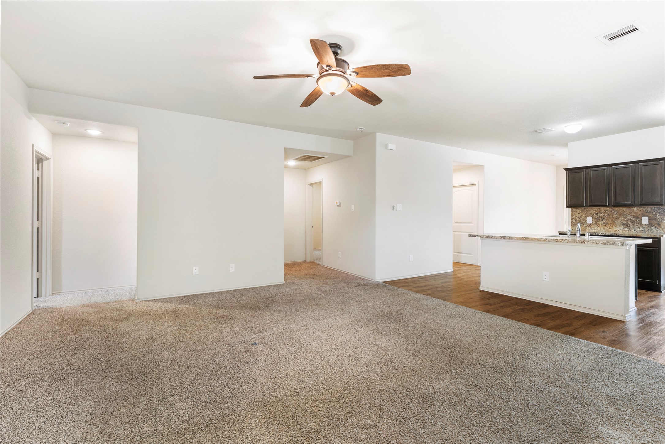 24407 Pigeon Berry Drive Spring, TX 77373 - Photo 15 of 34 a view of a kitchen with a sink and a refrigerator