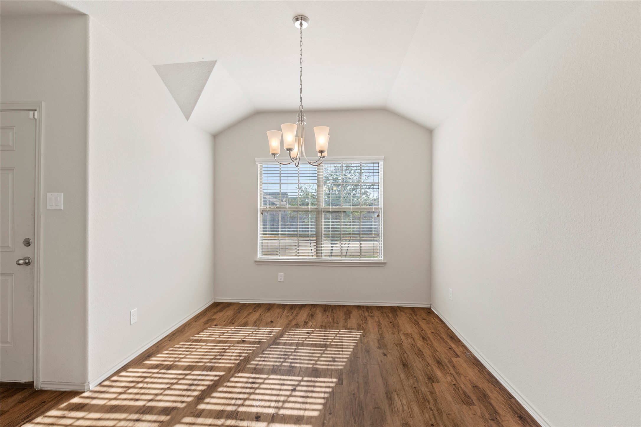 24407 Pigeon Berry Drive Spring, TX 77373 - Photo 5 of 34 a view of an empty room with chandelier and window