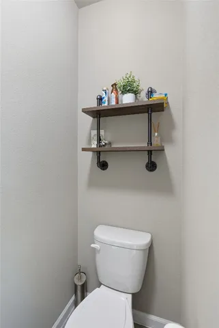a bathroom with a toilet and a sink