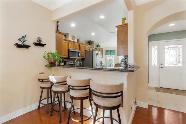 a kitchen with a table and chairs in it