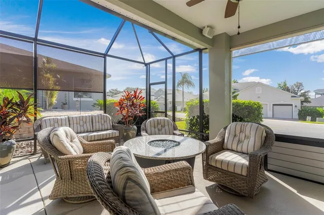 a view of a livingroom with furniture and a floor to ceiling window