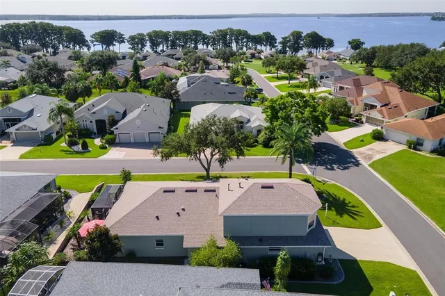 an aerial view of a house with yard swimming pool and outdoor seating