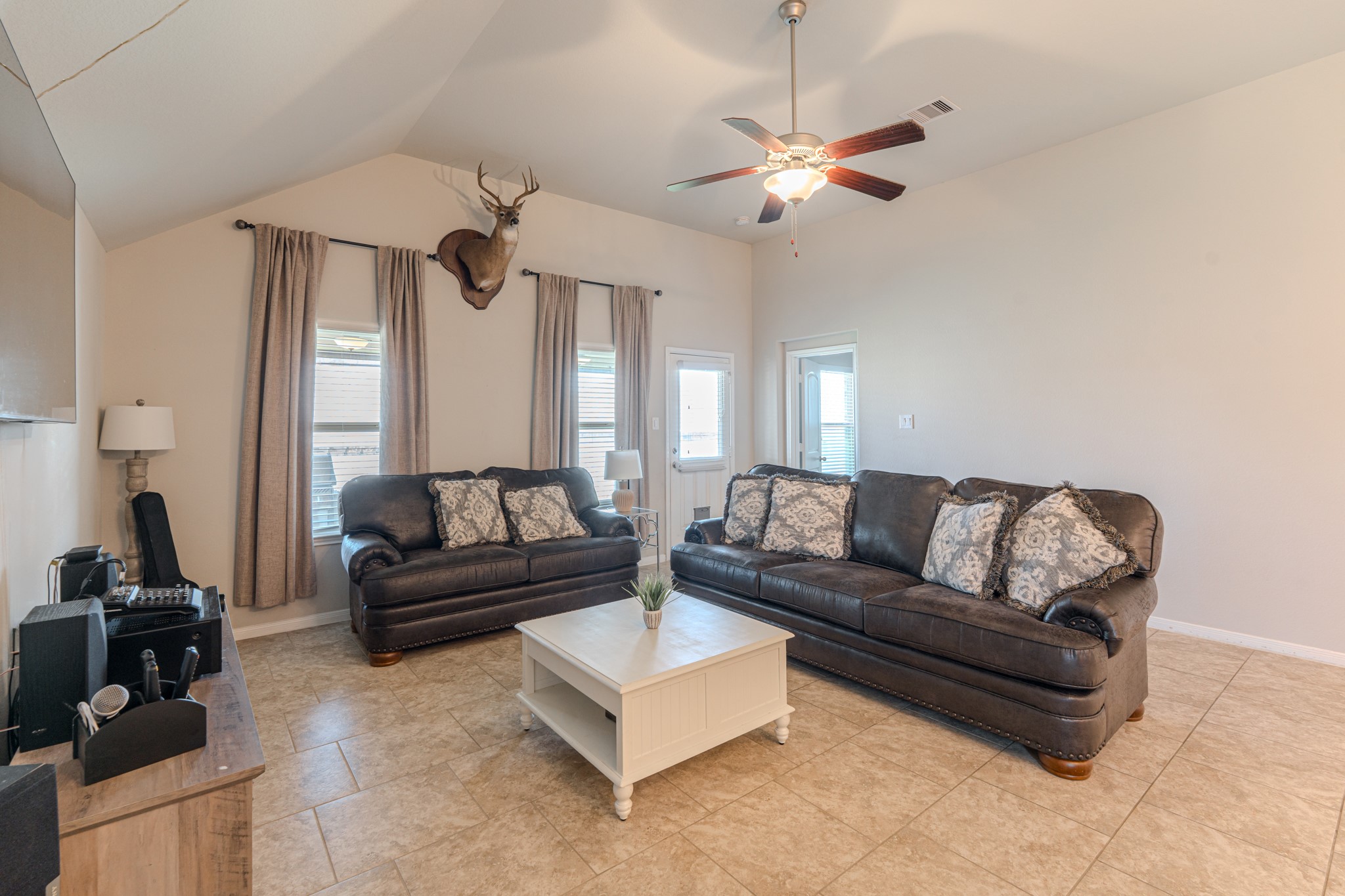 14207 Irvine Rnch Trail Conroe, TX 77384 - Photo 14 of 29 a living room with furniture and a chandelier