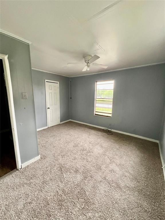 1803 Franklin Street, Unit 1 Bonham, TX 75418 - Photo 3 of 5 an empty room with windows and closet