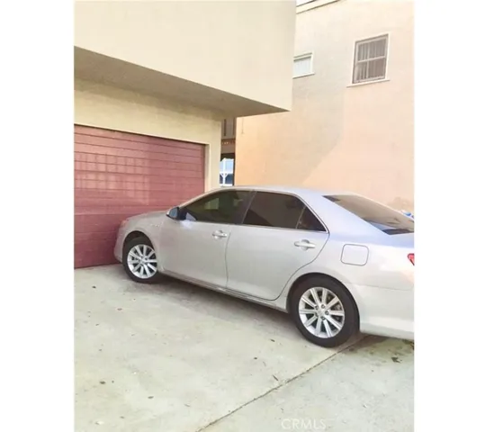 a kitchen with granite countertop a sink stove and cabinets