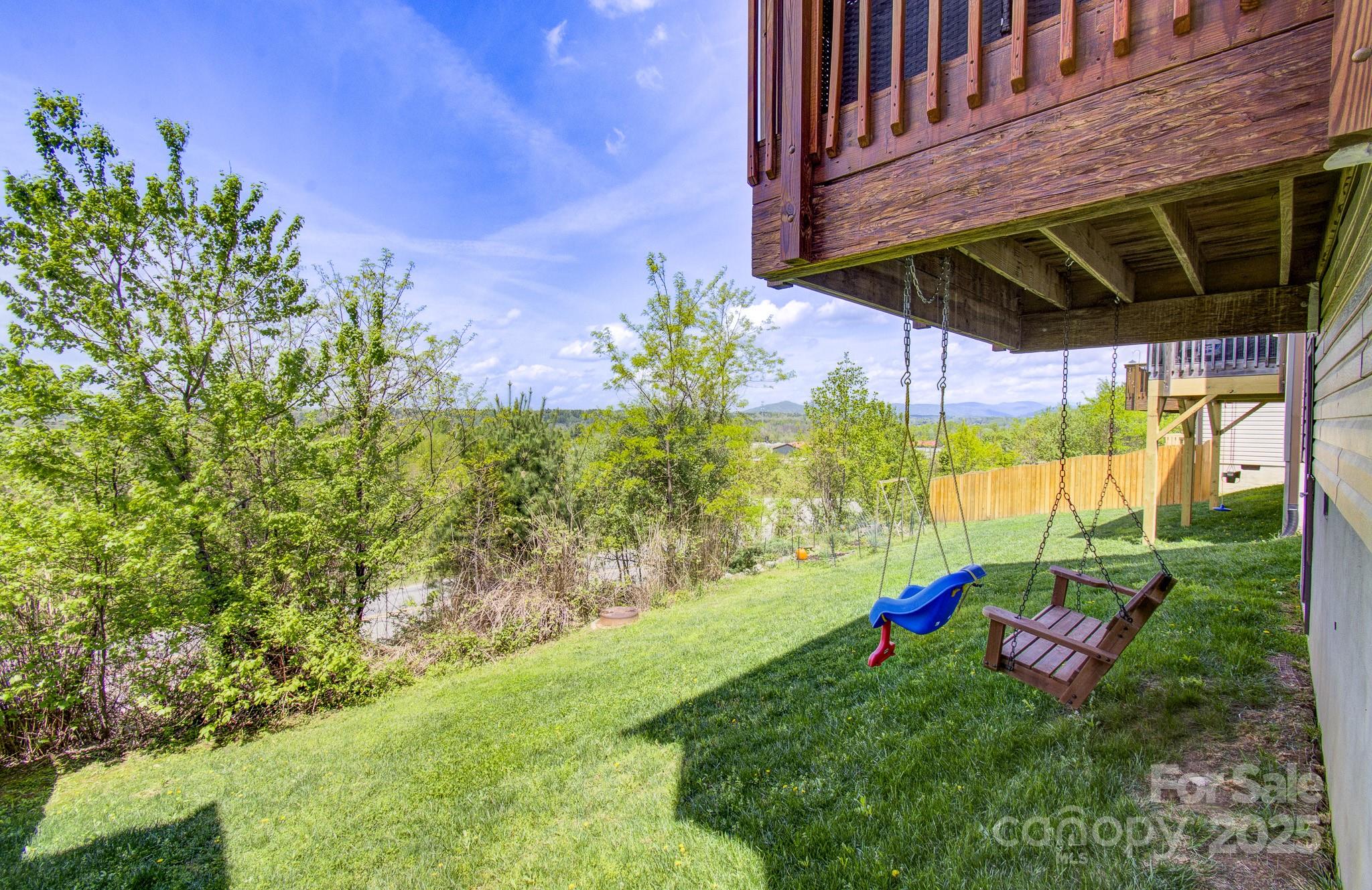 689 Cardwell Lane Fletcher, NC 28732 - Photo 16 of 39 a view of a backyard with plants