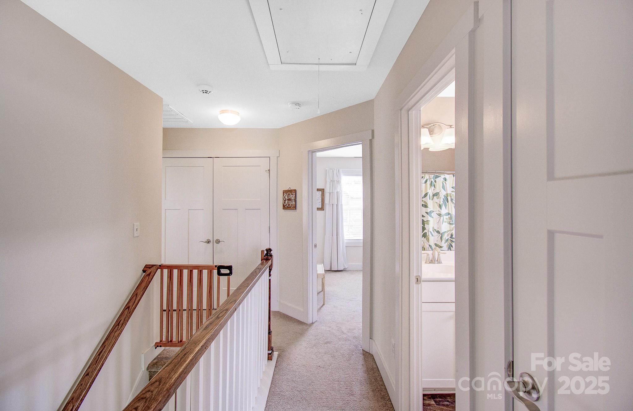 689 Cardwell Lane Fletcher, NC 28732 - Photo 17 of 39 a view of a hallway with wooden floor and staircase