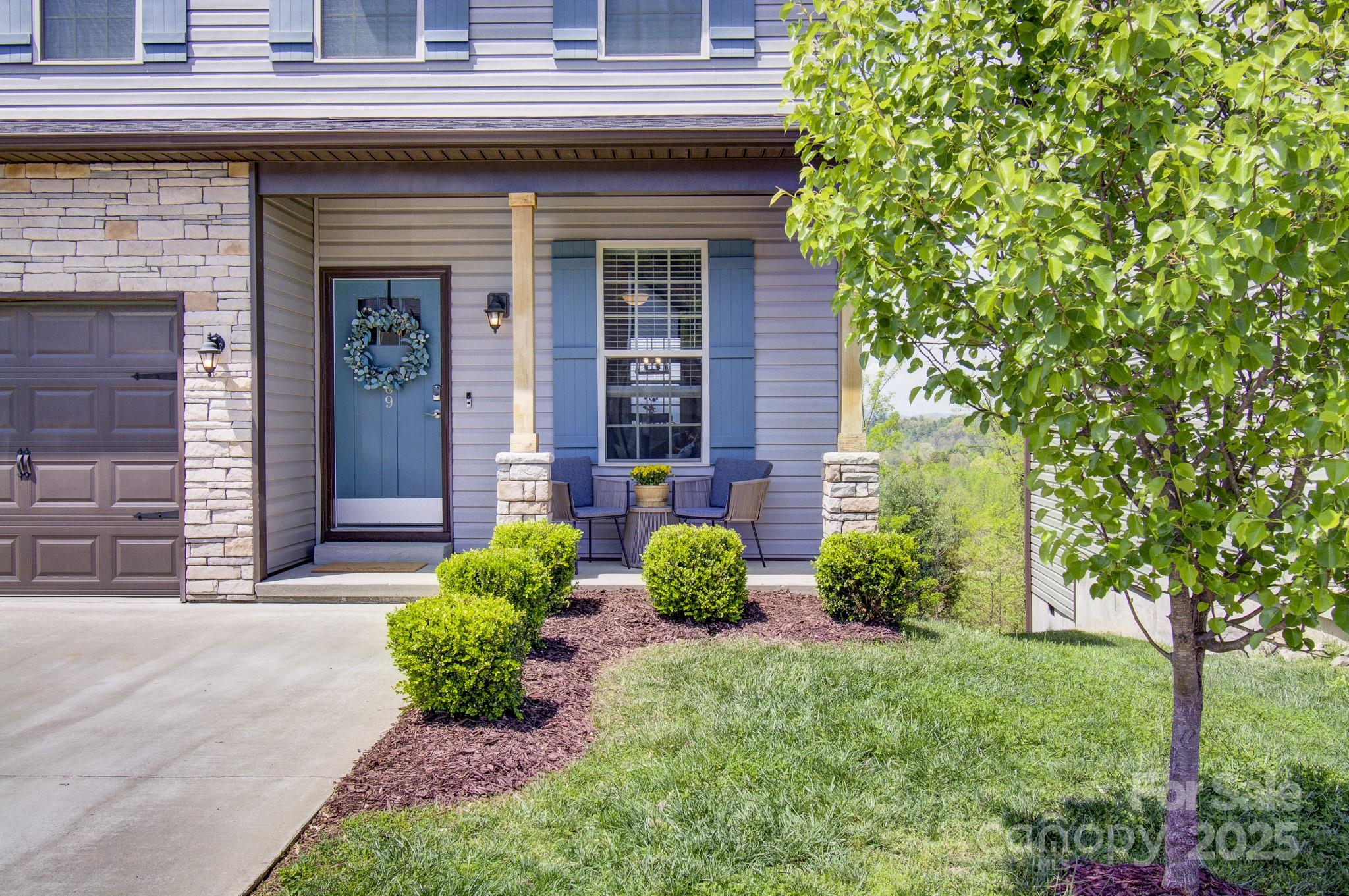 689 Cardwell Lane Fletcher, NC 28732 - Photo 2 of 39 a view of a house with brick walls and a yard with plants