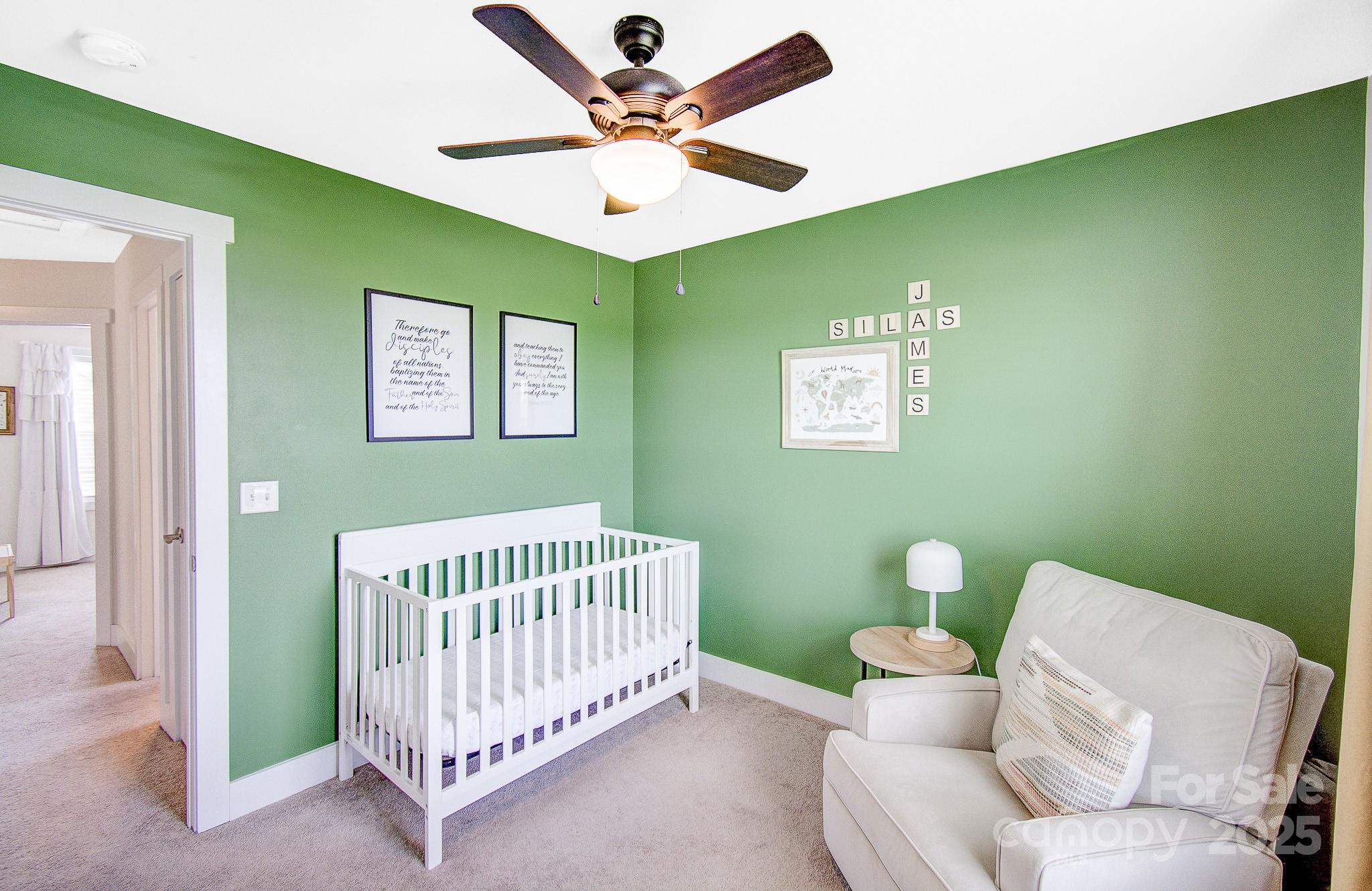 689 Cardwell Lane Fletcher, NC 28732 - Photo 30 of 39 a living room with furniture and a baby crib