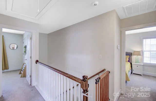 a view of a hallway to a livingroom and a hallway