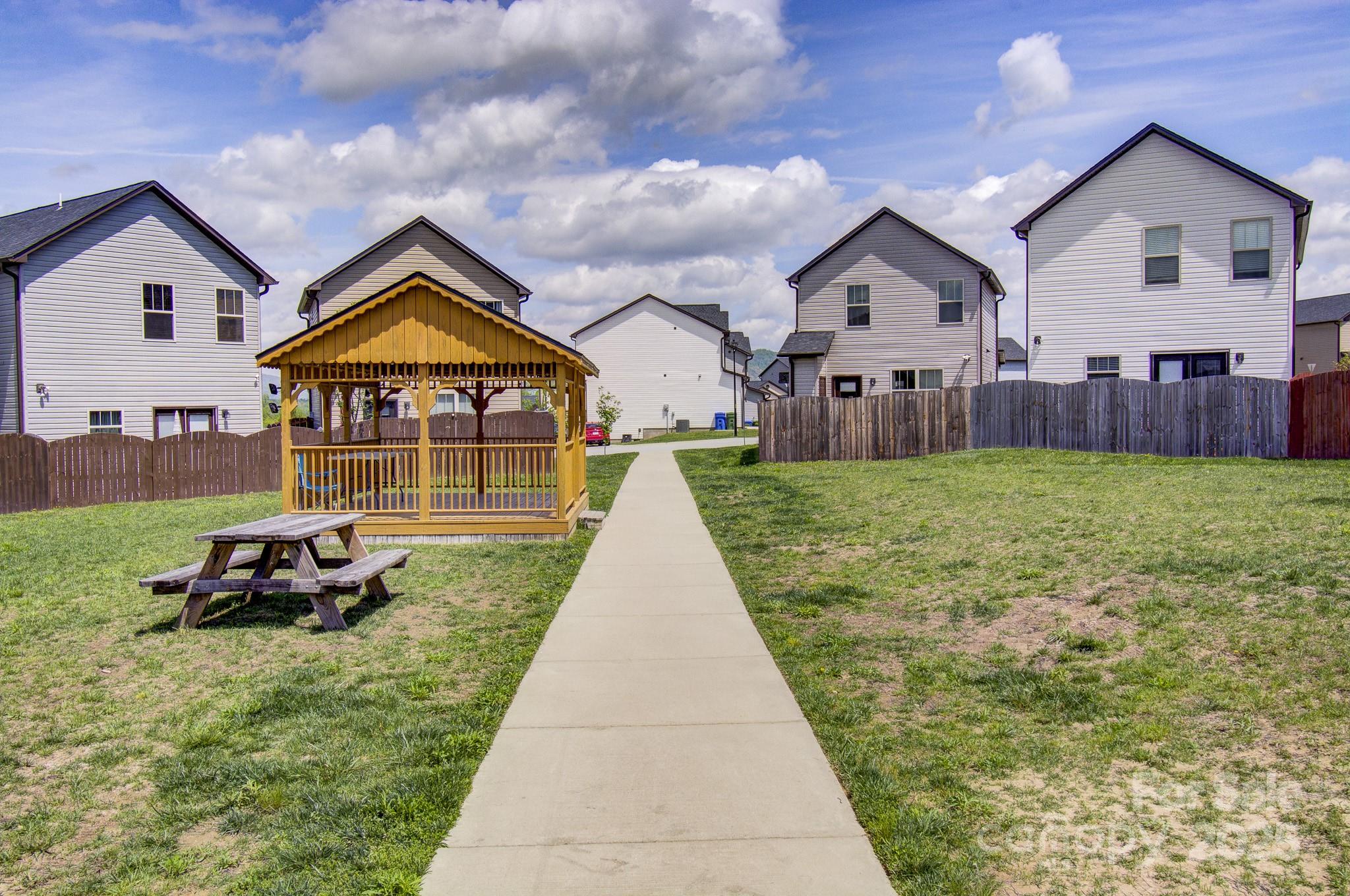 689 Cardwell Lane Fletcher, NC 28732 - Photo 39 of 39 a view of a house with a yard and sitting area