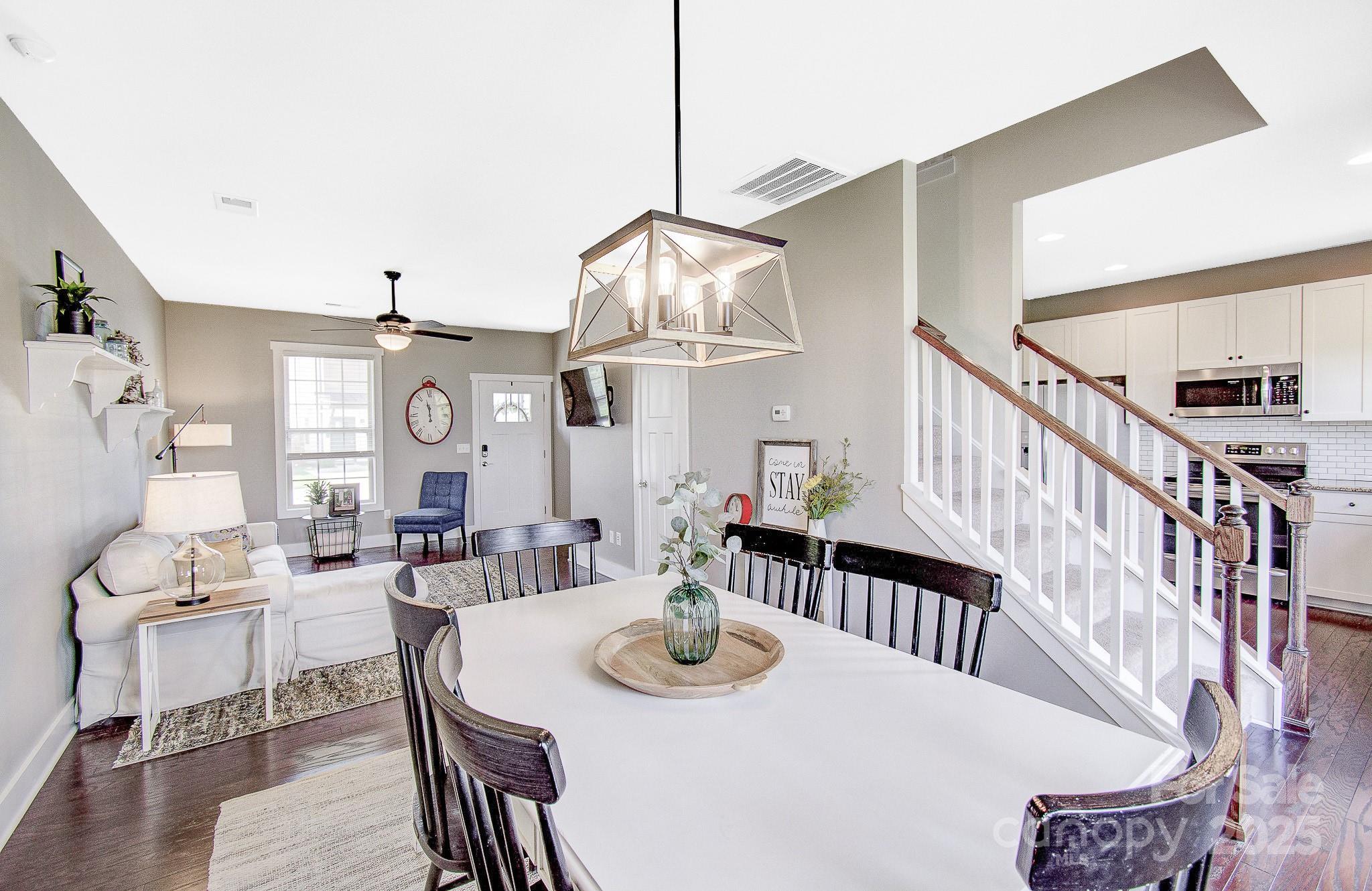 689 Cardwell Lane Fletcher, NC 28732 - Photo 6 of 39 a view of a dining room with furniture window and wooden floor