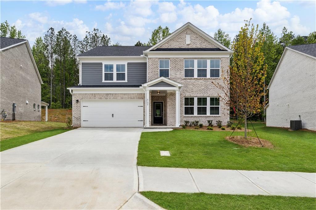 front view of a house with a yard