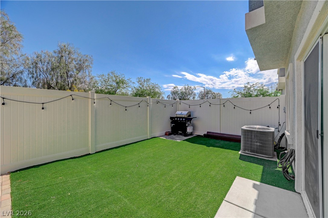 7204 North Decatur Boulevard, Unit 3 North Las Vegas, NV 89084 - Photo 36 of 48 A low-maintenance yard, enclosed for privacy, offers a perfect spot for grilling.