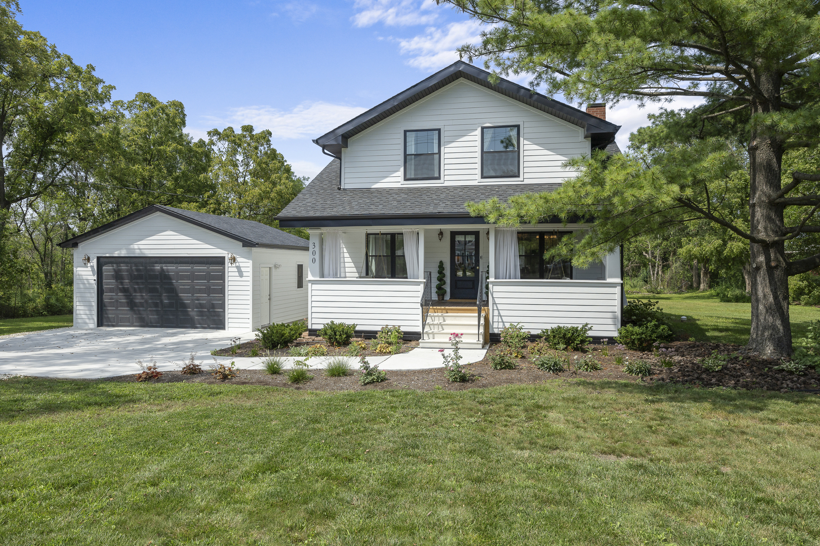 300 Geneva Road Glen Ellyn, IL 60137 - Photo 1 of 41 a front view of house with yard and green space