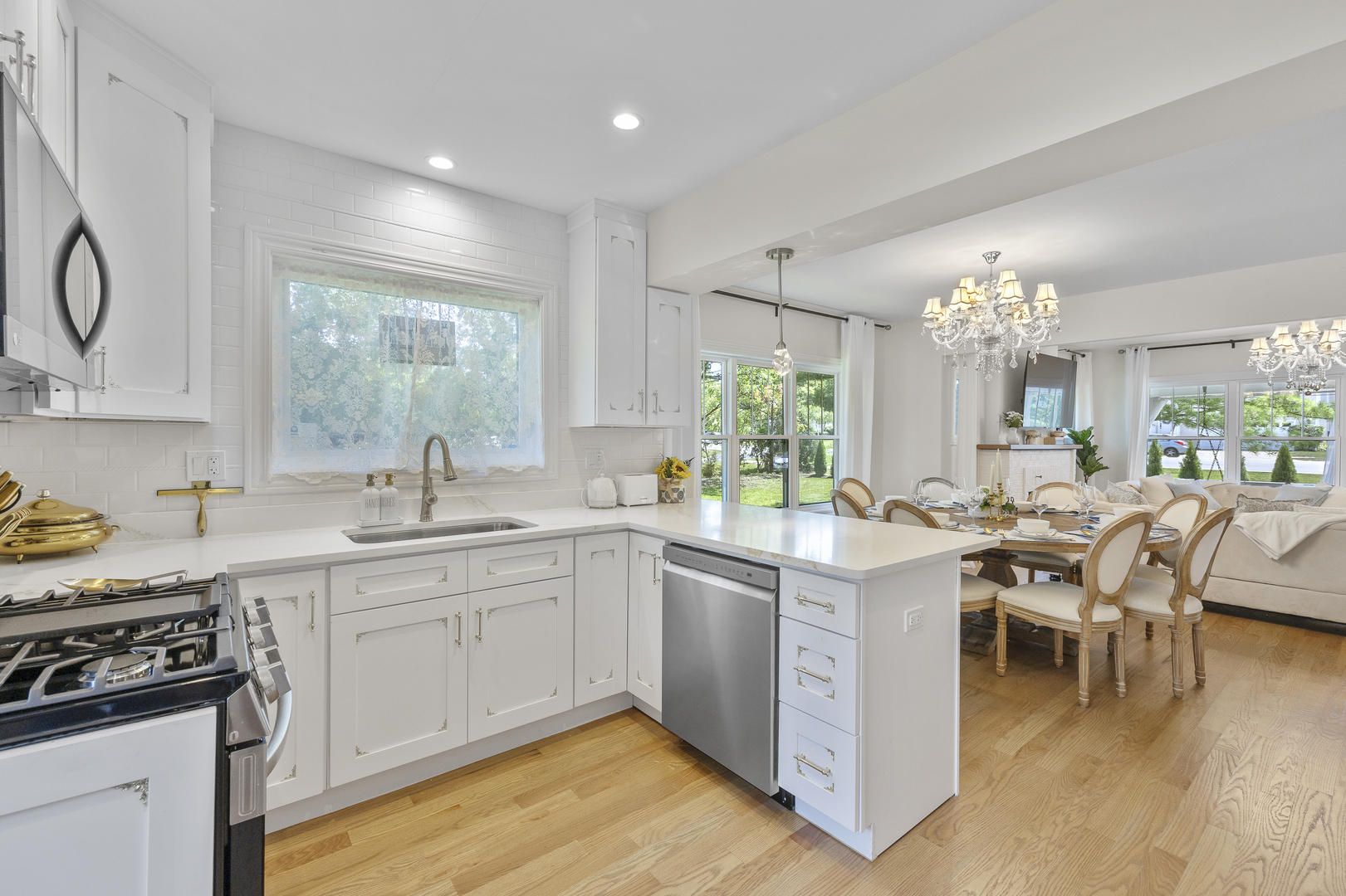 300 Geneva Road Glen Ellyn, IL 60137 - Photo 13 of 41 a kitchen with a sink stove and cabinets