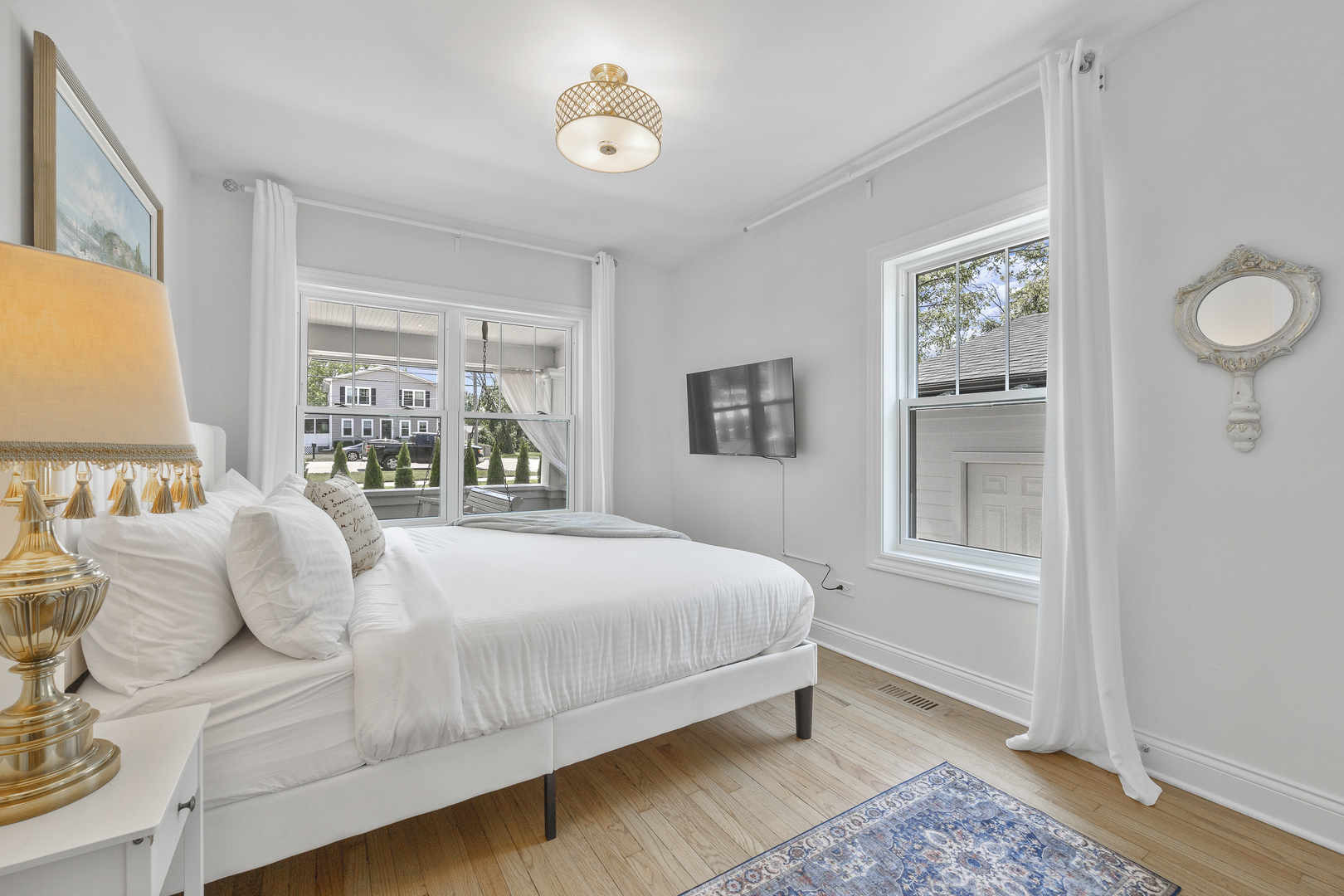 300 Geneva Road Glen Ellyn, IL 60137 - Photo 15 of 41 a bedroom with a large bed and a window