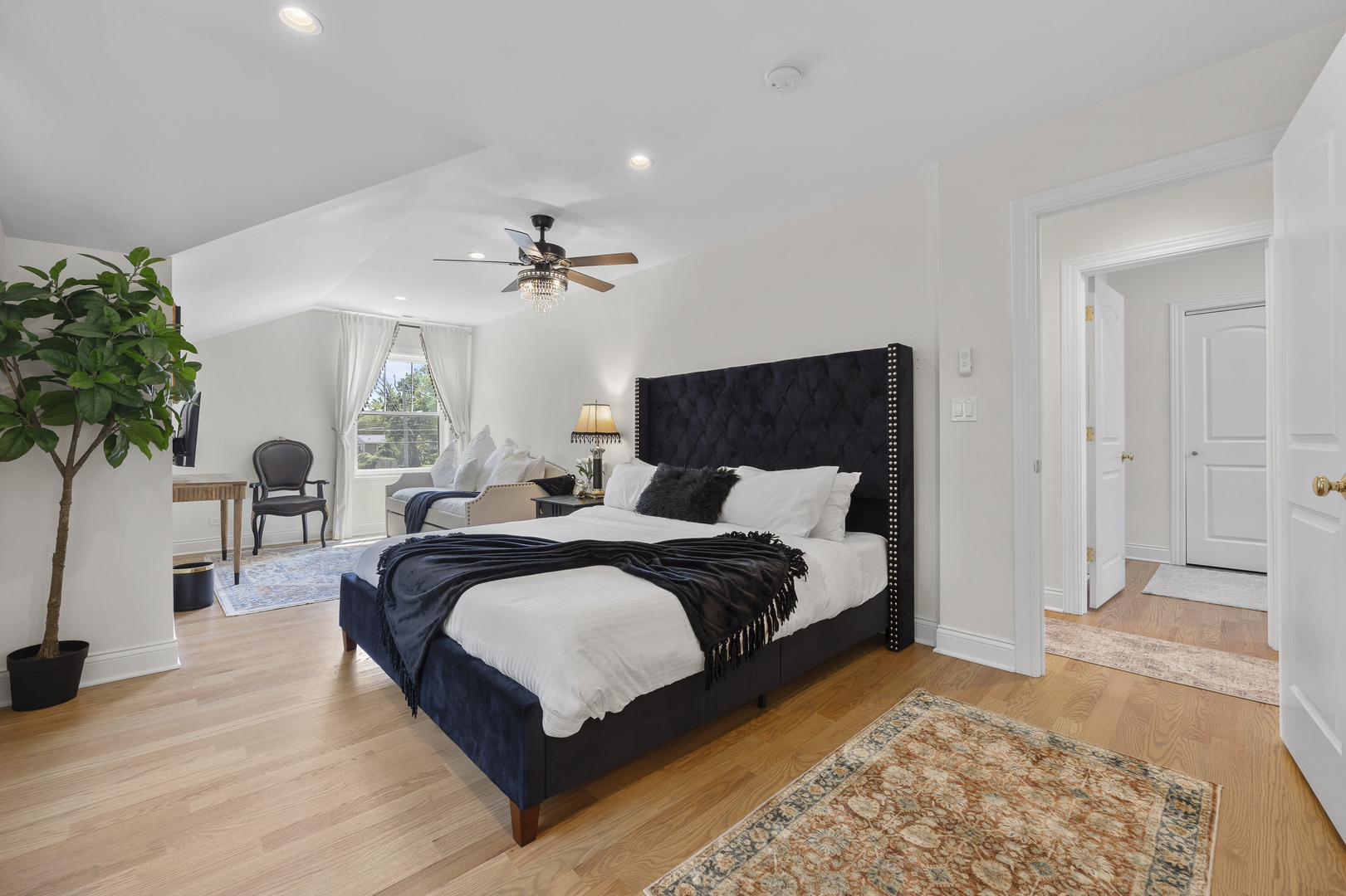 300 Geneva Road Glen Ellyn, IL 60137 - Photo 19 of 41 a spacious bedroom with a large bed and a potted plant