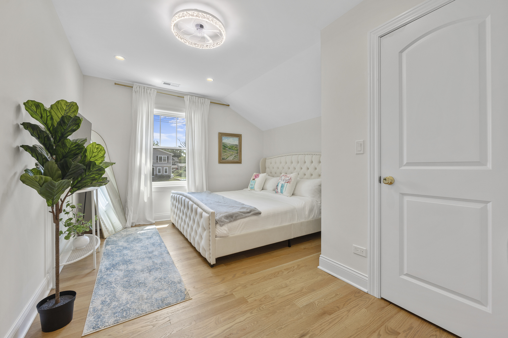 300 Geneva Road Glen Ellyn, IL 60137 - Photo 23 of 41 a bedroom with a bed and a potted plant