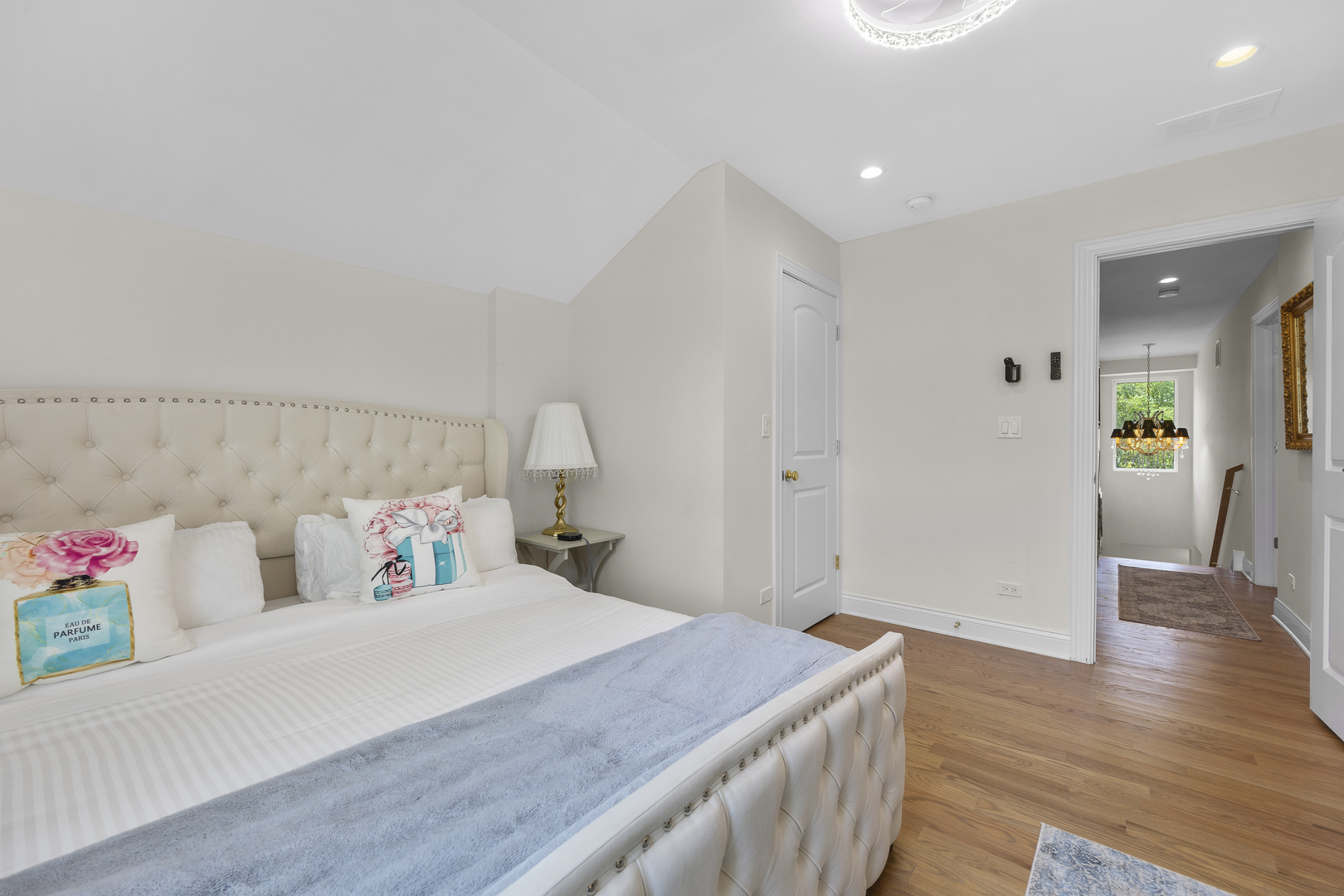 300 Geneva Road Glen Ellyn, IL 60137 - Photo 24 of 41 a bedroom with a bed and a wooden floor