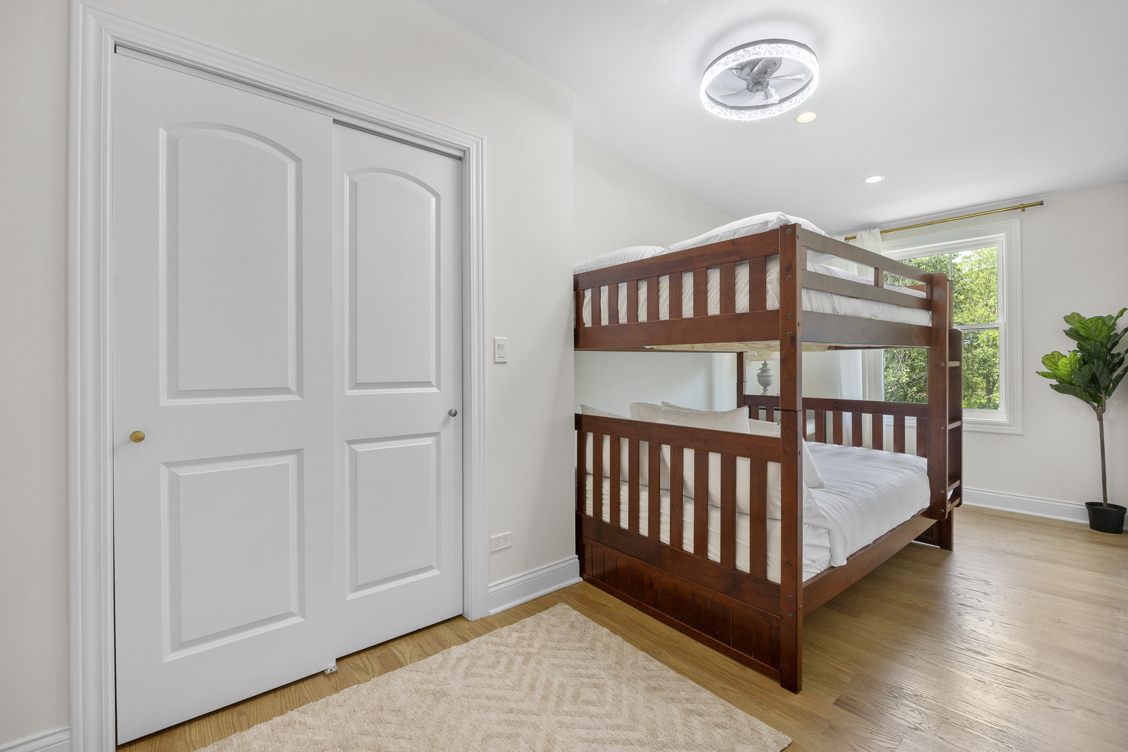 300 Geneva Road Glen Ellyn, IL 60137 - Photo 25 of 41 a bedroom with a bed and wooden floor