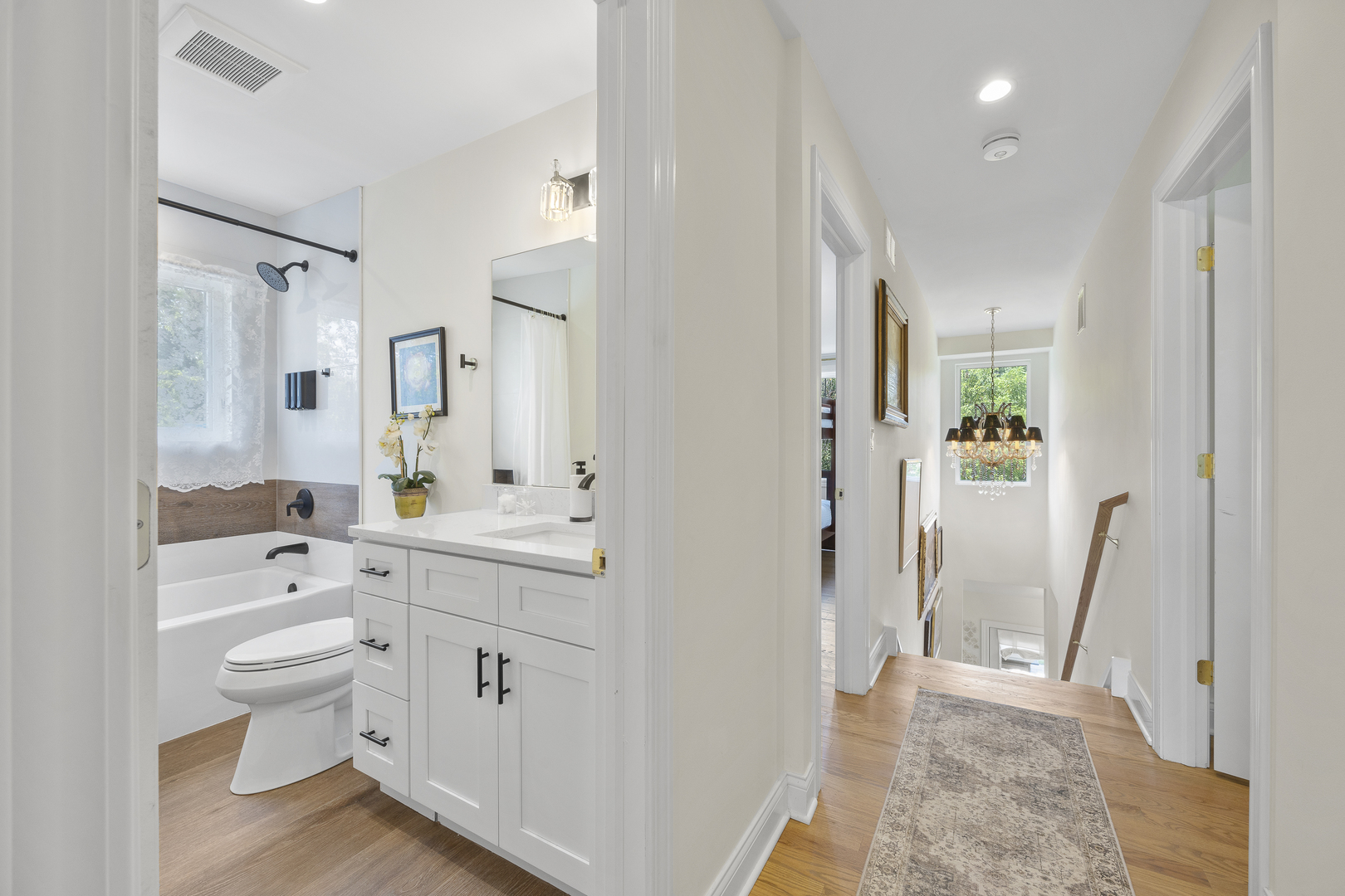 300 Geneva Road Glen Ellyn, IL 60137 - Photo 26 of 41 a spacious bathroom with a double vanity sink a toilet and a mirror